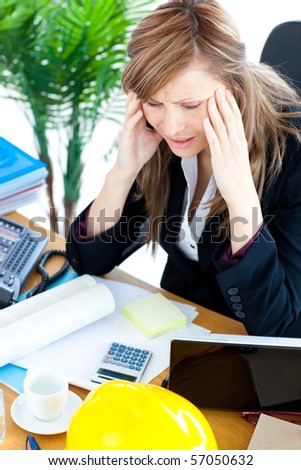 Stressed  businesswoman having a headache in the office