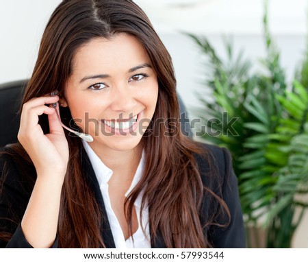 Confident asian businesswoman wearing headphones against white background
