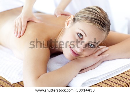 Caucasian young woman receiving a health treatment in a spa center