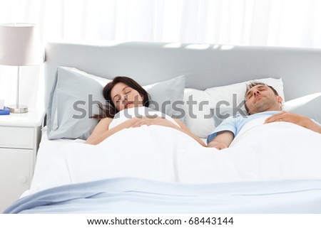Lovely Couple Holding Their Hands While Sleeping On Their Bed At Home ...