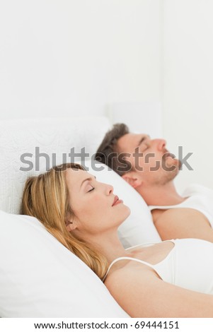 Calm pairs sleeping together at home