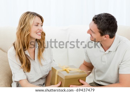 Man offering a gift to his wife