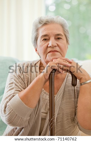 Senior woman with her walking stick