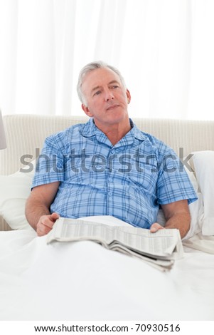 Man thinking in his bed at home