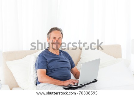 Smiling man looking at the camera at home