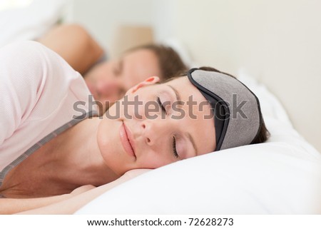 Lovely couple lying down in their bed