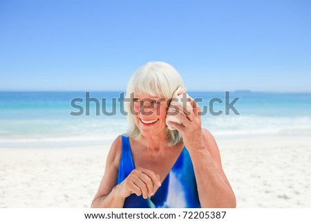Woman listening to her shell