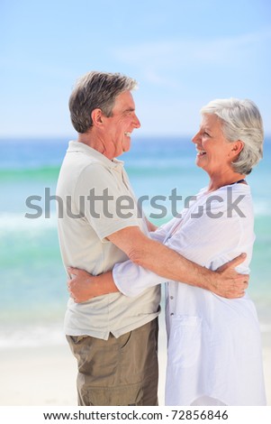 Elderly man embracing his wife