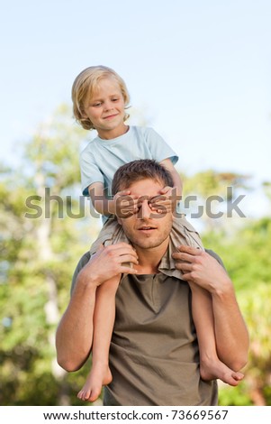 Father giving son a piggyback