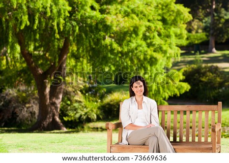 Brunette woman on the bench