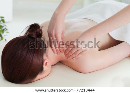 Red-haired woman having a rolling massage
