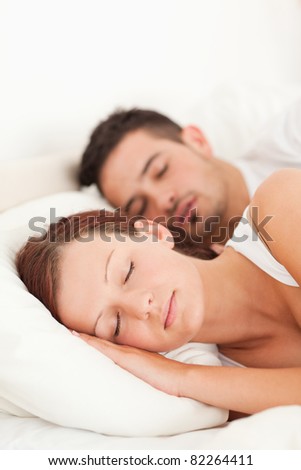 Portrait of a Sleeping couple in their bedroom
