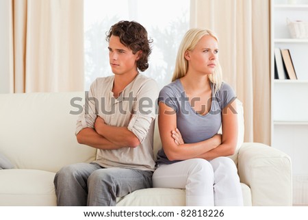 Man angry at her fiance with the arms crossed