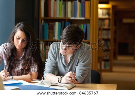 Students Writing An Essay In A Library Stock Photo 84635767 : Shutterstock