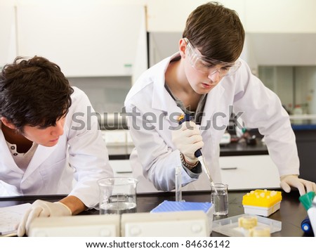 Chemistry students making an experiment in a laboratory