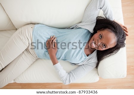 Smiling woman taking a break on the sofa