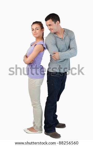 Young Couple Standing Back-To-Back To Each Other Against A White ...