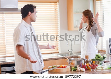 Young couple disputing in the kitchen