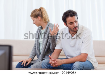 Woman being mad at her husband in their living room