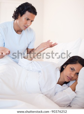 Young couple having a dispute in the bedroom