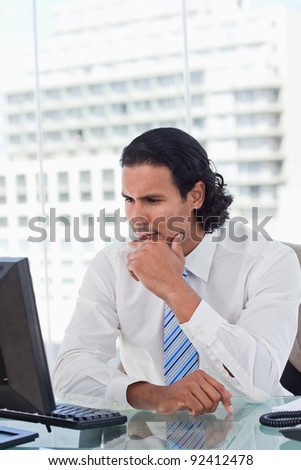 Portrait of a businessman thinking in his office