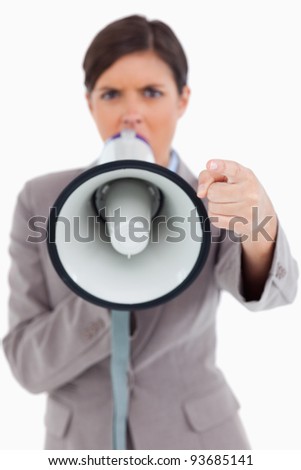 Close up of megaphone being used by angry entrepreneur against a white background