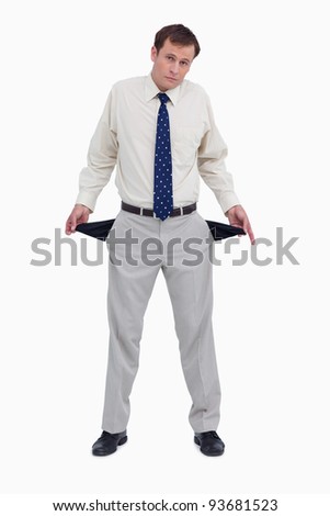 Sad businessman showing his empty pockets against a white background
