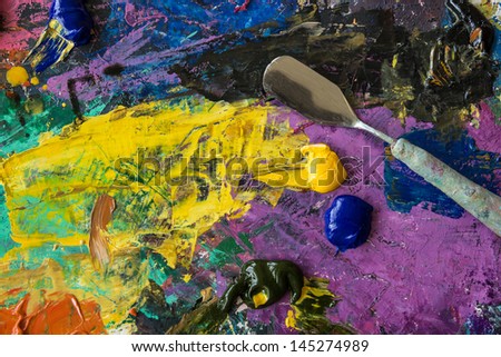 Oil paints palette with palette knife