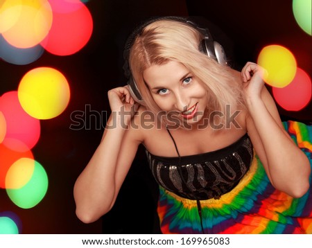 Women dj in headphones listening music isolated on a black background