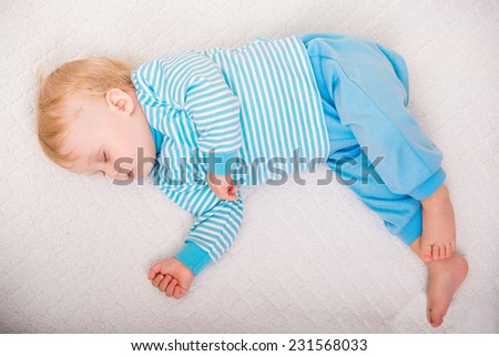 baby sleep on bed. top view