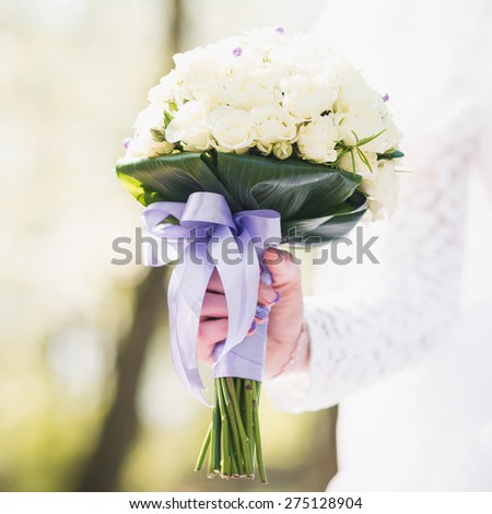 Closeup of wedding flowers bouquet on natural garden background