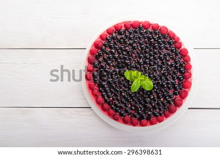 Sweet cake with currant and raspberries
