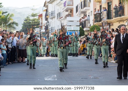 MALAGA, SPAIN - APRIL 18: Unidentified spanish legionnaires marching during an Easter parade on April 18, 2014 in Alhaurin de la Torre, Malaga, Spain.