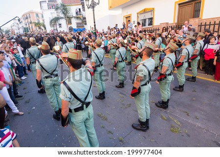 MALAGA, SPAIN - APRIL 18: Unidentified spanish legionnaires playing cornets during an Easter parade on April 18, 2014 in Alhaurin de la Torre, Malaga, Spain.
