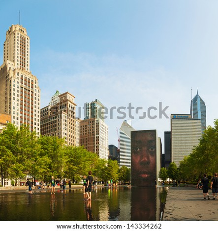 CHICAGO - MAY 18: Cityscape of Chicago with Crown Fountain on May 18, 2013 in Chicago, Illinois. It\'s is an interactive work of public art and video sculpture featured in Chicago\'s Millennium Park.