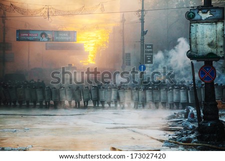 KIEV, UKRAINE - JANUARY 24: A row of the riot police at Hrushevskogo street on January 24, 2014 in Kiev, Ukraine. The anti-governmental protests turned into violent clashes during last week.