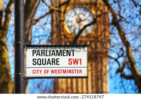 LONDON - APRIL 12: Parliament square sign in city of Westminster on April 12, 2015 in London, UK. It\'s a square at the northwest end of the Palace of Westminster in London.