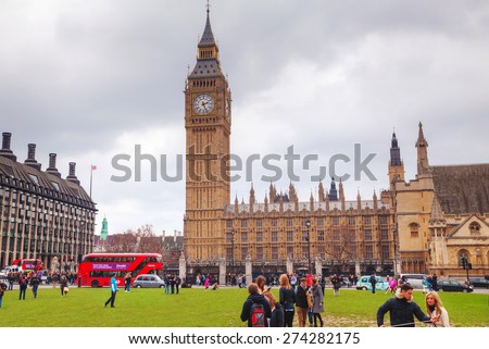 LONDON - APRIL 4: Parliament square with people in city of Westminster on April 4, 2015 in London, UK. It\'s a square at the northwest end of the Palace of Westminster in London.