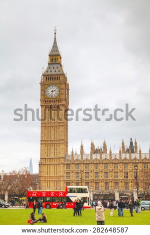 LONDON - APRIL 4: Parliament square with people in city of Westminster on April 4, 2015 in London, UK. It\'s a square at the northwest end of the Palace of Westminster in London.