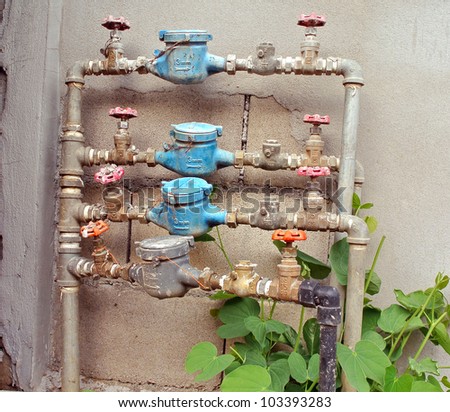 old rusty  water pipe, meter and valve
