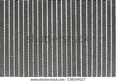Old automobile radiator surface as a background for the automotive industry