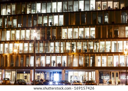 WARSAW - DECEMBER 19: The lights in the windows of an office building called the Metropolitan, built in 2003 by architect Sir Norman Foster in Warsaw in Poland on December 19, 2013