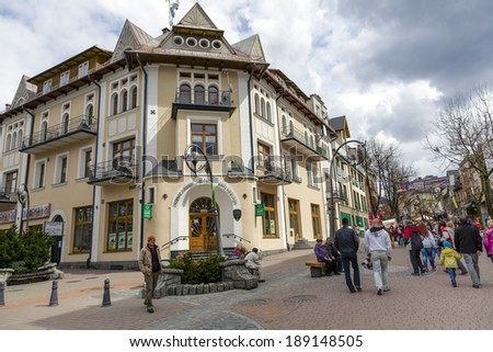 ZAKOPANE, POLAND - APRIL 20, 2014: Seat of Podhalanski Cooperative Bank in historic brick building, built early XX century, in the center of the shopping and pedestrian zone in the city