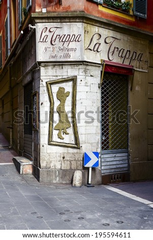 NICE, FRANCE - MAY 16, 2014: La Trappa Bar at the junction of narrow streets in the Old Town shows the architecture detail of historic part of the city