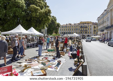NICE, FRANCE - MAY 17, 2014: The Antique Market, held on Saturdays, on the built late 18th century Garibaldi square, located at the outskirts of the Old Town