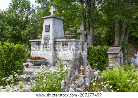 ZAKOPANE, POLAND - JUNE 23, 2014: Monument to the World War II Victims in the New Cemetery, erected in 1962, Here lie the victims of executions done by Nazi in the city during the World War II
