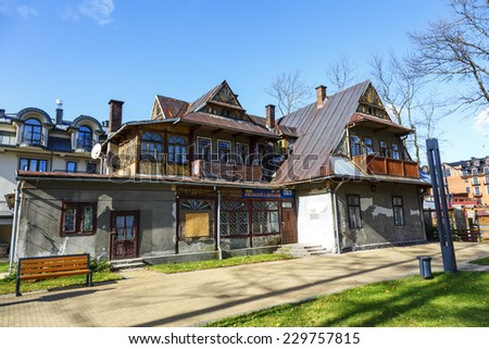 ZAKOPANE, POLAND - OCTOBER 14, 2014: Former building of The School of Music, built around 1896, made of wood in Zakopane style, then partially plastered