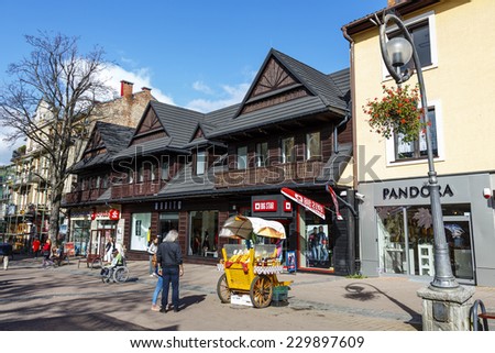 ZAKOPANE, POLAND - OCTOBER 14, 2014: Commercial premises located in wooden villa, built approx. 1910, at the main pedestrian street in the city named Krupowki