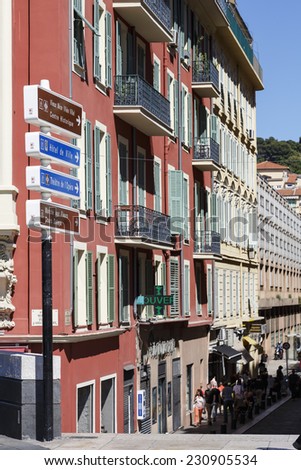 NICE, FRANCE - MAY 24, 2014: Set on the edge of Massena Square directional signs point the way hiking trails to the historic center of the old town and to the famous Cours Saleya Market