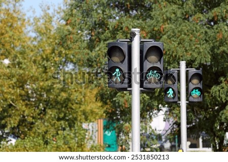 Similar – Image, Stock Photo Cyclist appears on the line from the airfield